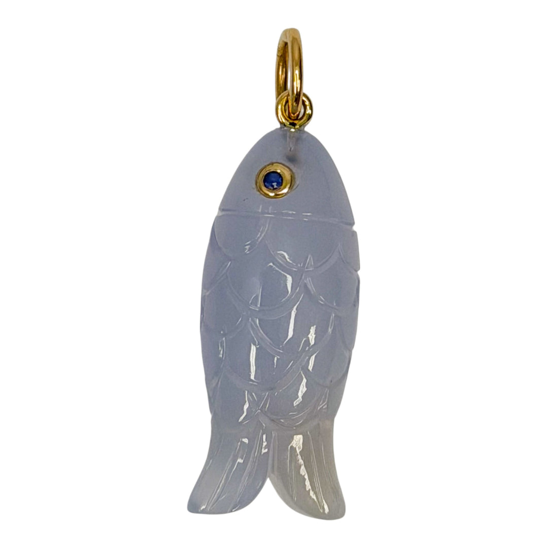 Agate fish-shaped pendant with 14k gold and sapphire accents on a white background.