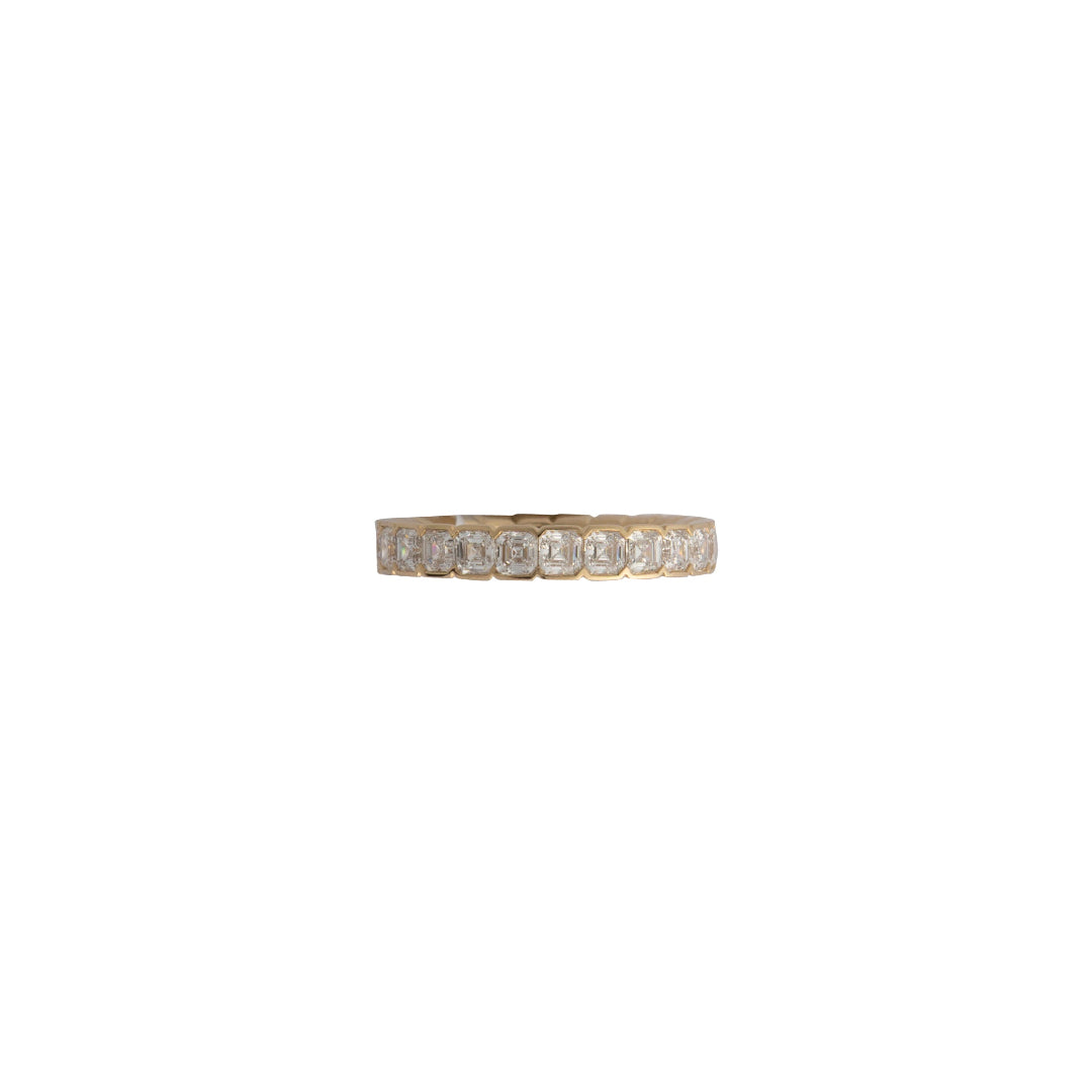 A gold band featuring lab-grown diamonds arranged in a specific pattern, set horizontally.