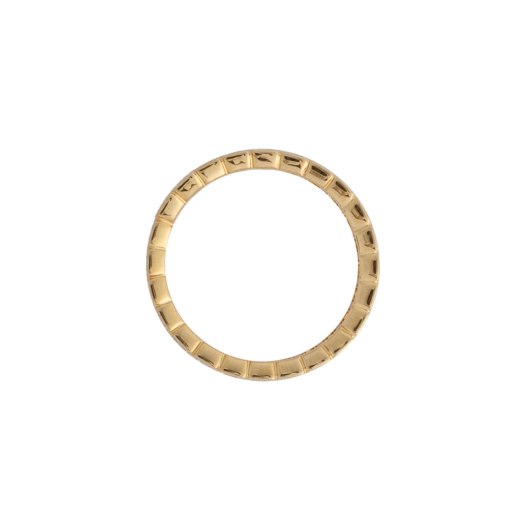 A gold eternity band with asher cut lab-grown diamonds set in a circle.