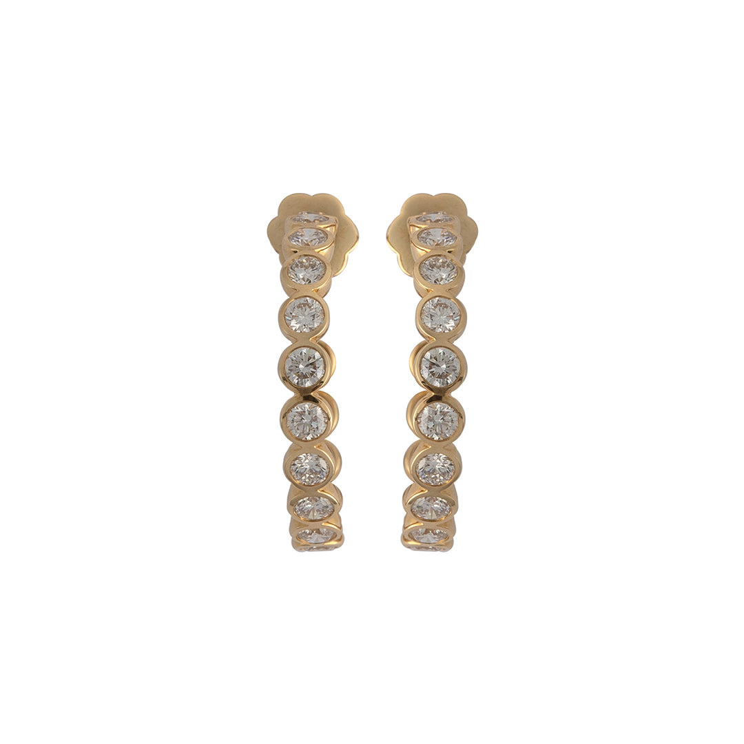 A pair of bezel set round lab-grown diamond C hoop earrings in 14k gold.
