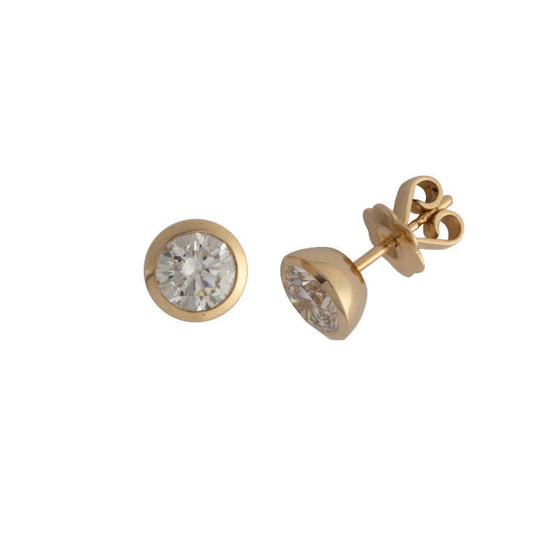 Gold stud earrings with bezel set lab grown diamonds on a white background.