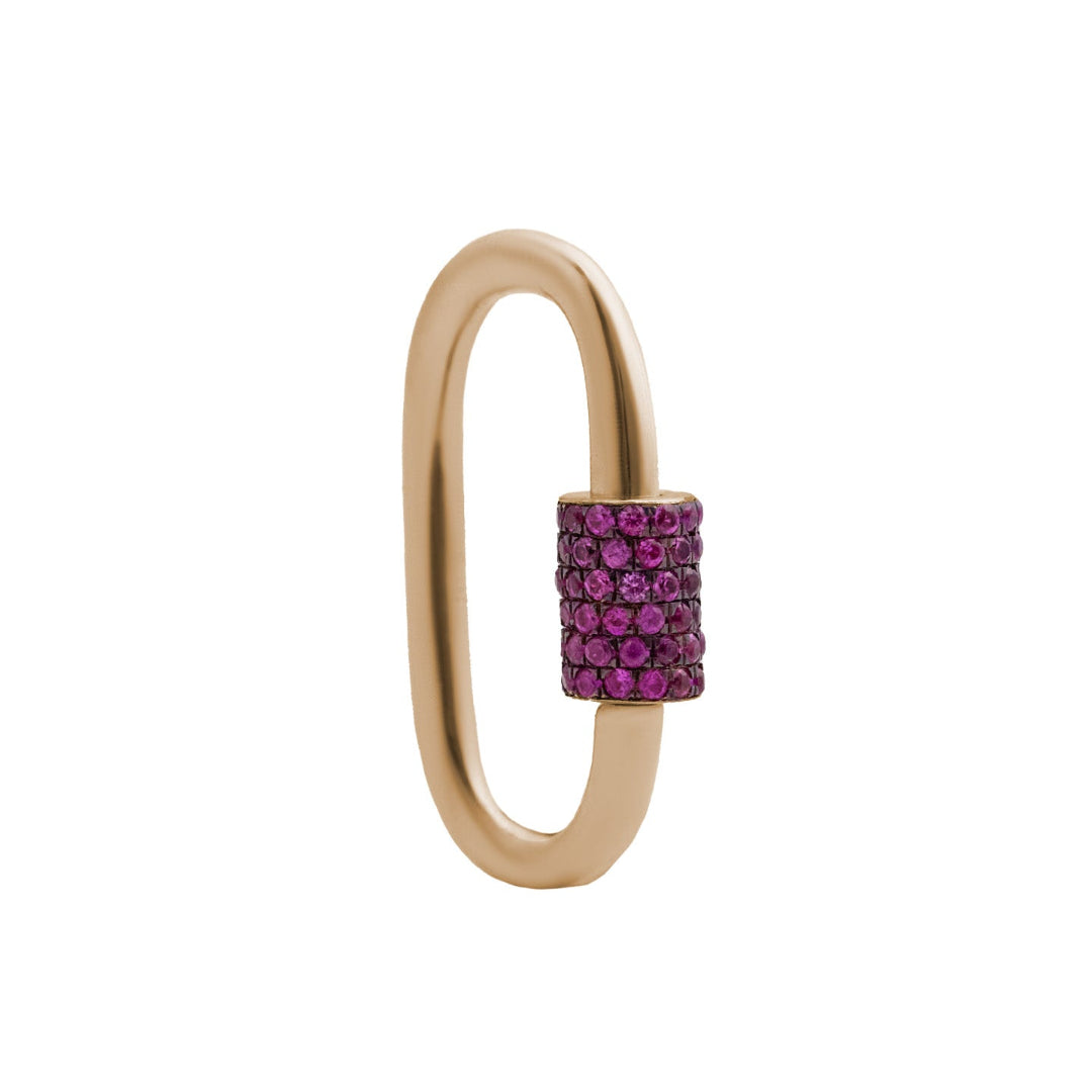 A gold-colored carabiner with a pink sapphire screw lock on a white background.