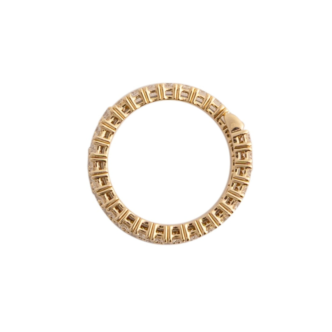 Gold flexi ring with a diamonds on a white background.