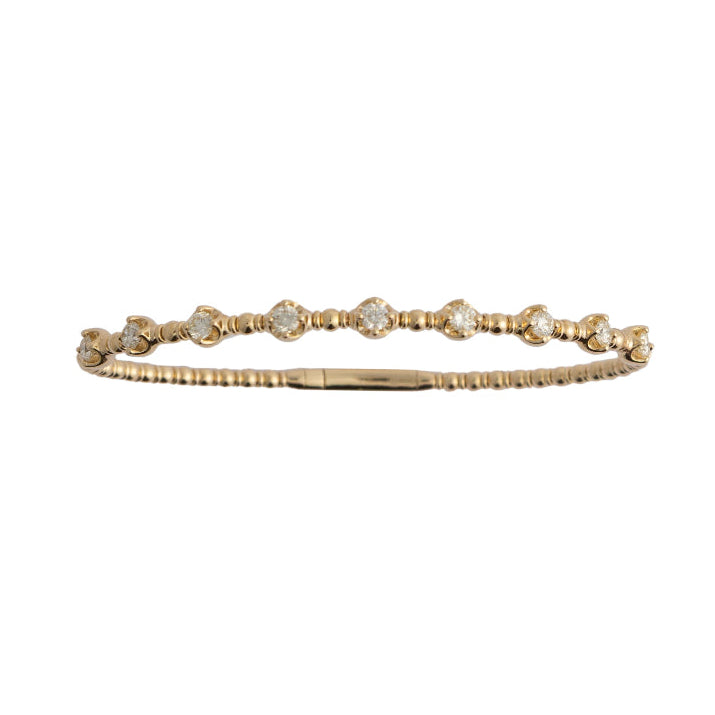 Gold bracelet with small diamonds on a white background