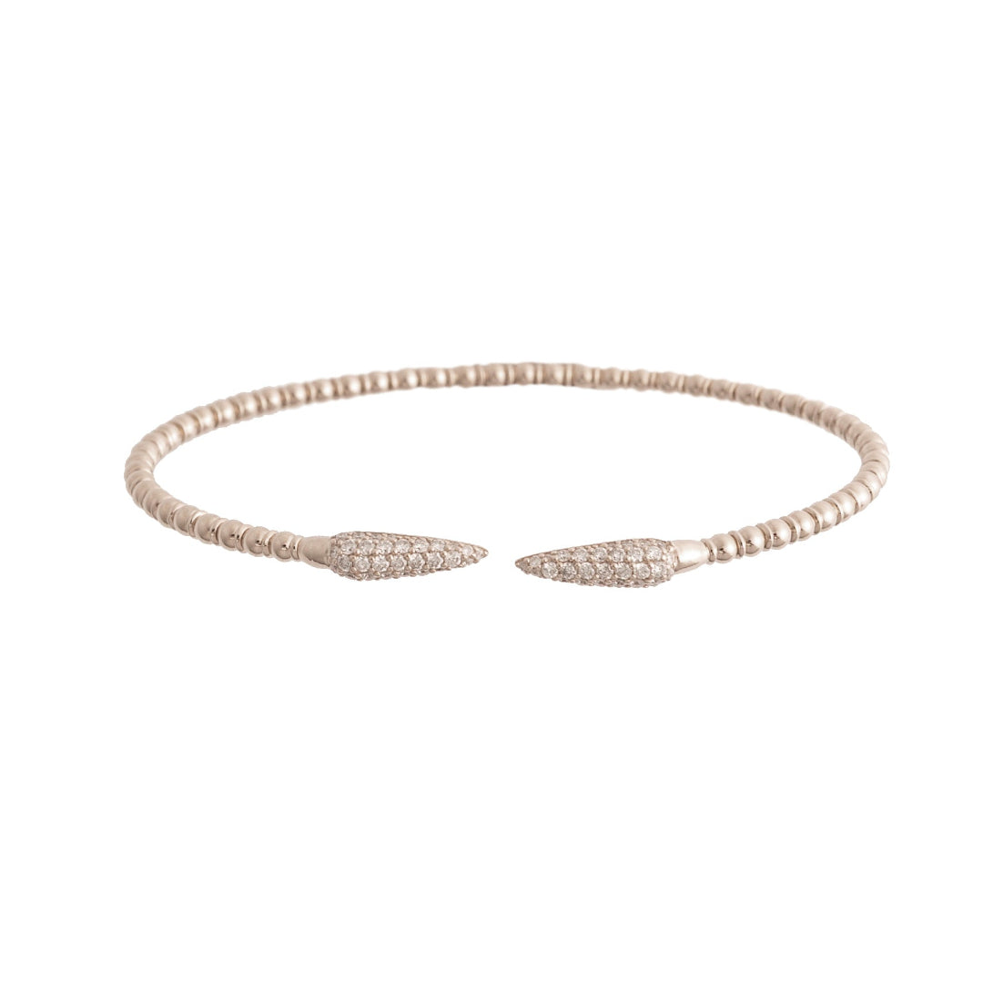 White gold bracelet with diamond pave claw design on a white background