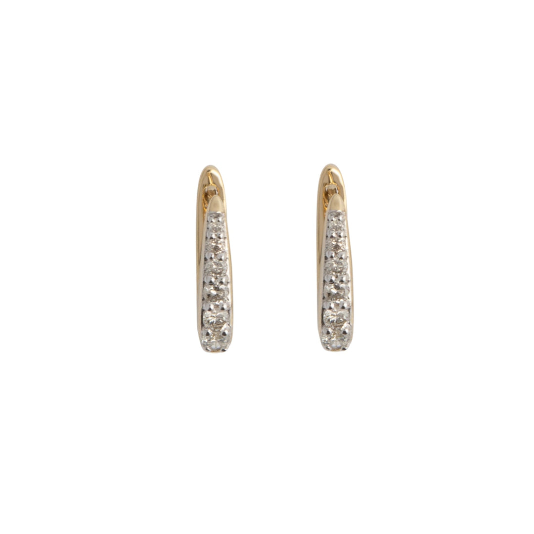 A pair of 14k gold Claw Diamond Huggie Earrings with a V-shaped design and diamond embellishments.