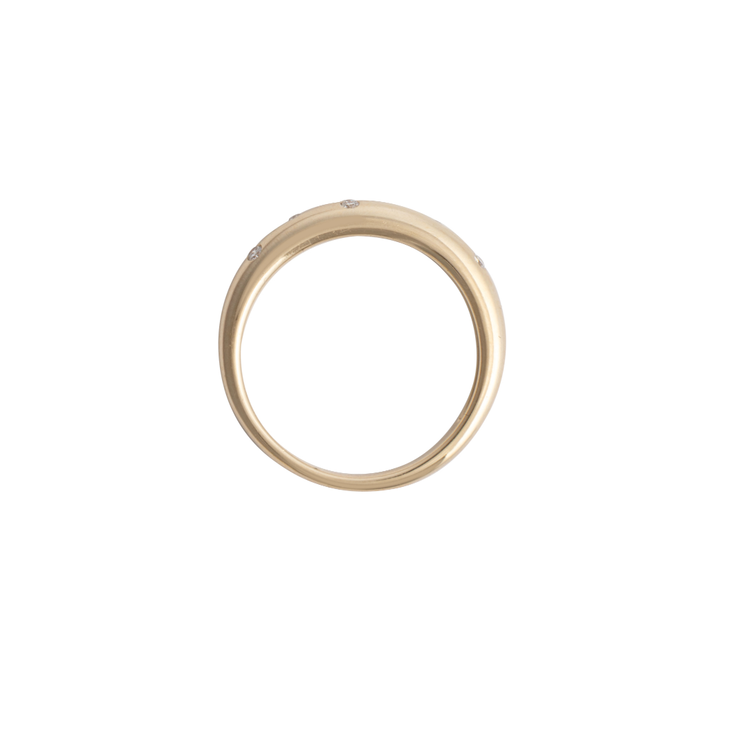 A white background with a sideways view of a gold ring.