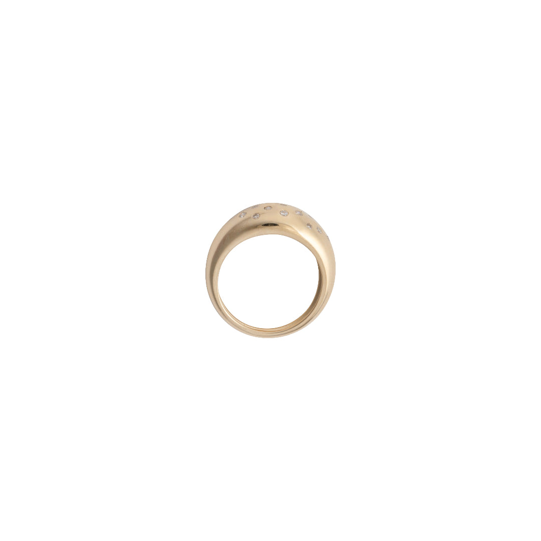 A side view of a 14k gold dome ring set on a white background