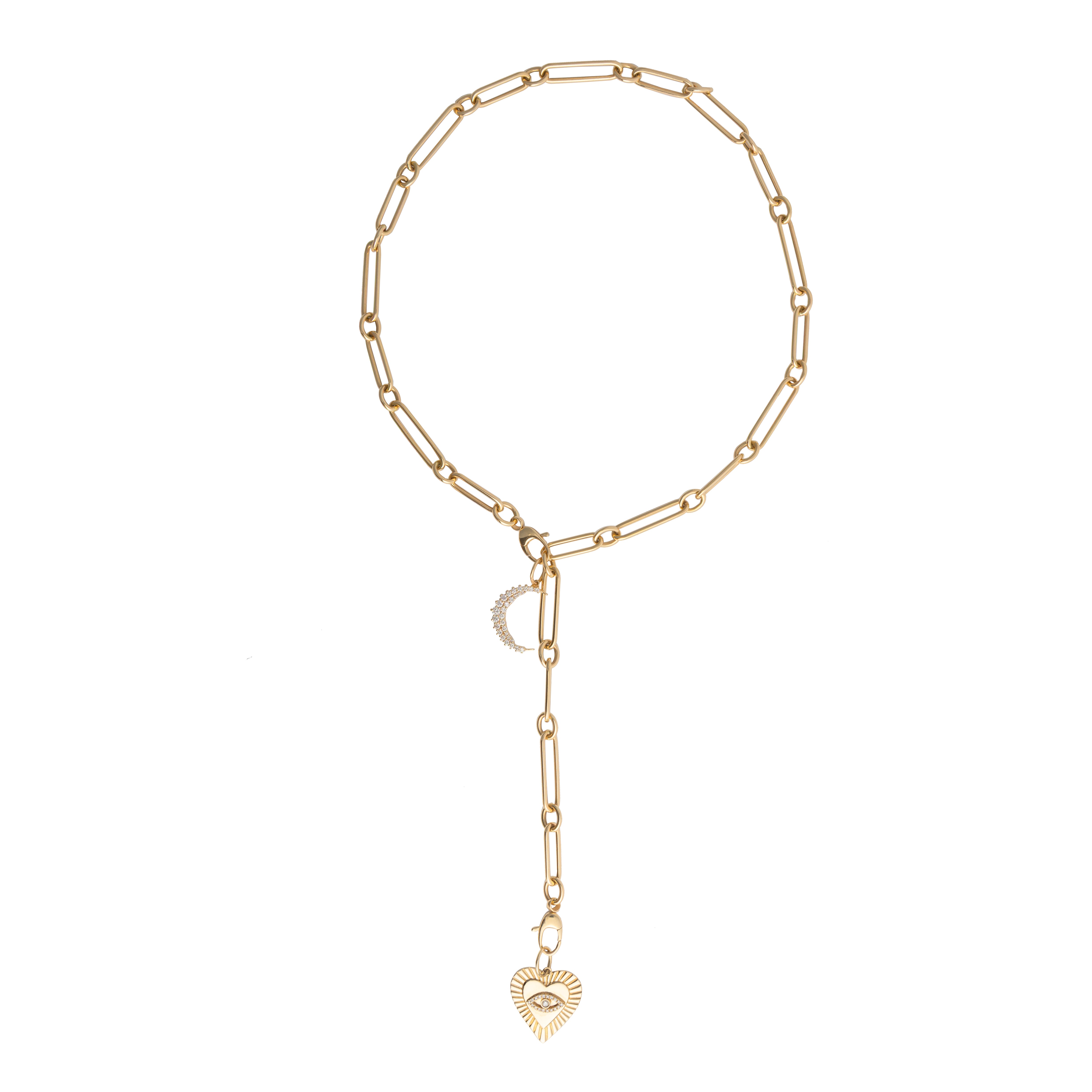 Gold chain necklace with crescent moon diamond pendant and a heart and eye pendants on a white background