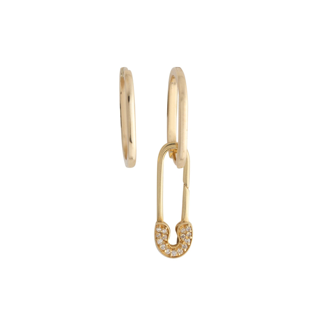 A pair of gold earrings, one shaped as an elongated oval hoop and the other as an edgy safety pin with diamond accents.