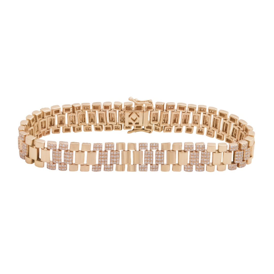 A gold watch band bracelet adorned with diamonds, featuring a sleek design.