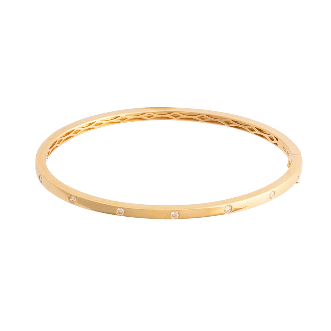 Gold bracelet with a diamonds on a white background