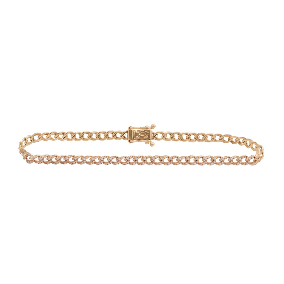 A gold Cuban link chain bracelet with diamond accents, displayed against a white background.
