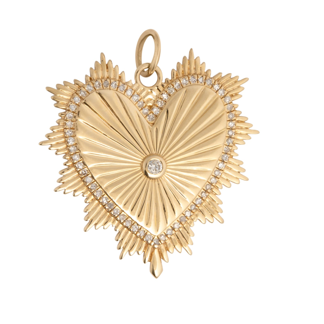 A 14k gold heart-shaped pendant with beveled edges and a central diamond, on a white background.