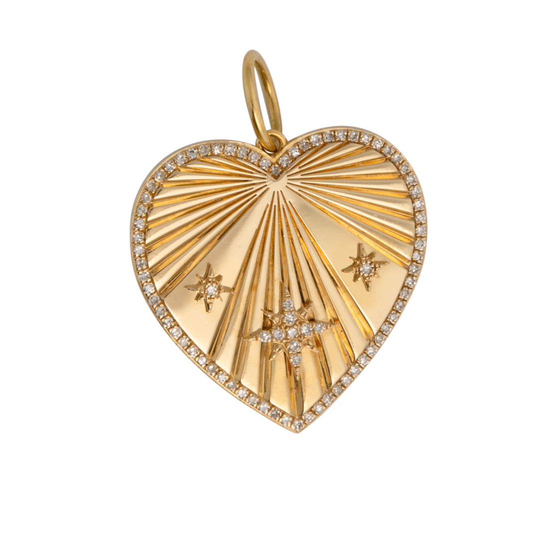 A gold heart-shaped pendant featuring three diamond rays and additional small diamonds set within the heart.