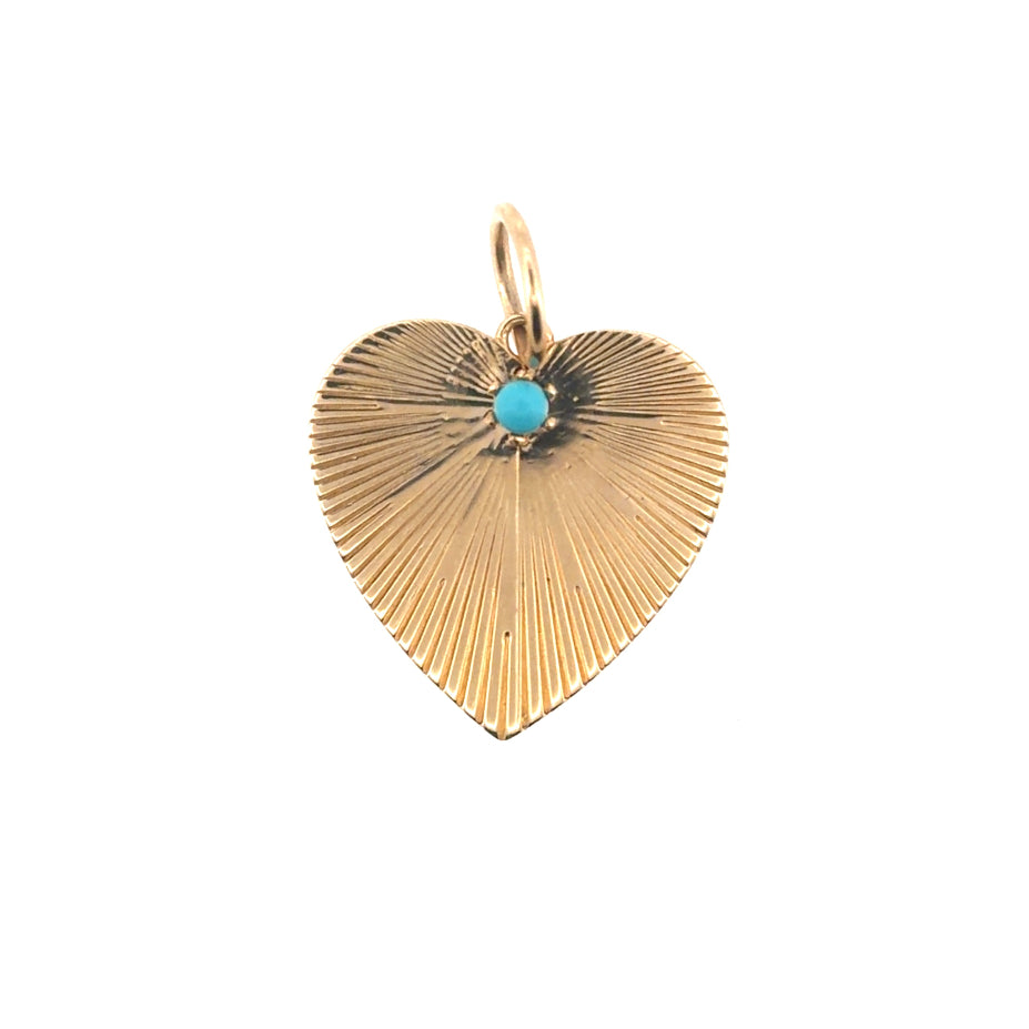 A 14k gold heart-shaped pendant with a turquoise stone ona white background.