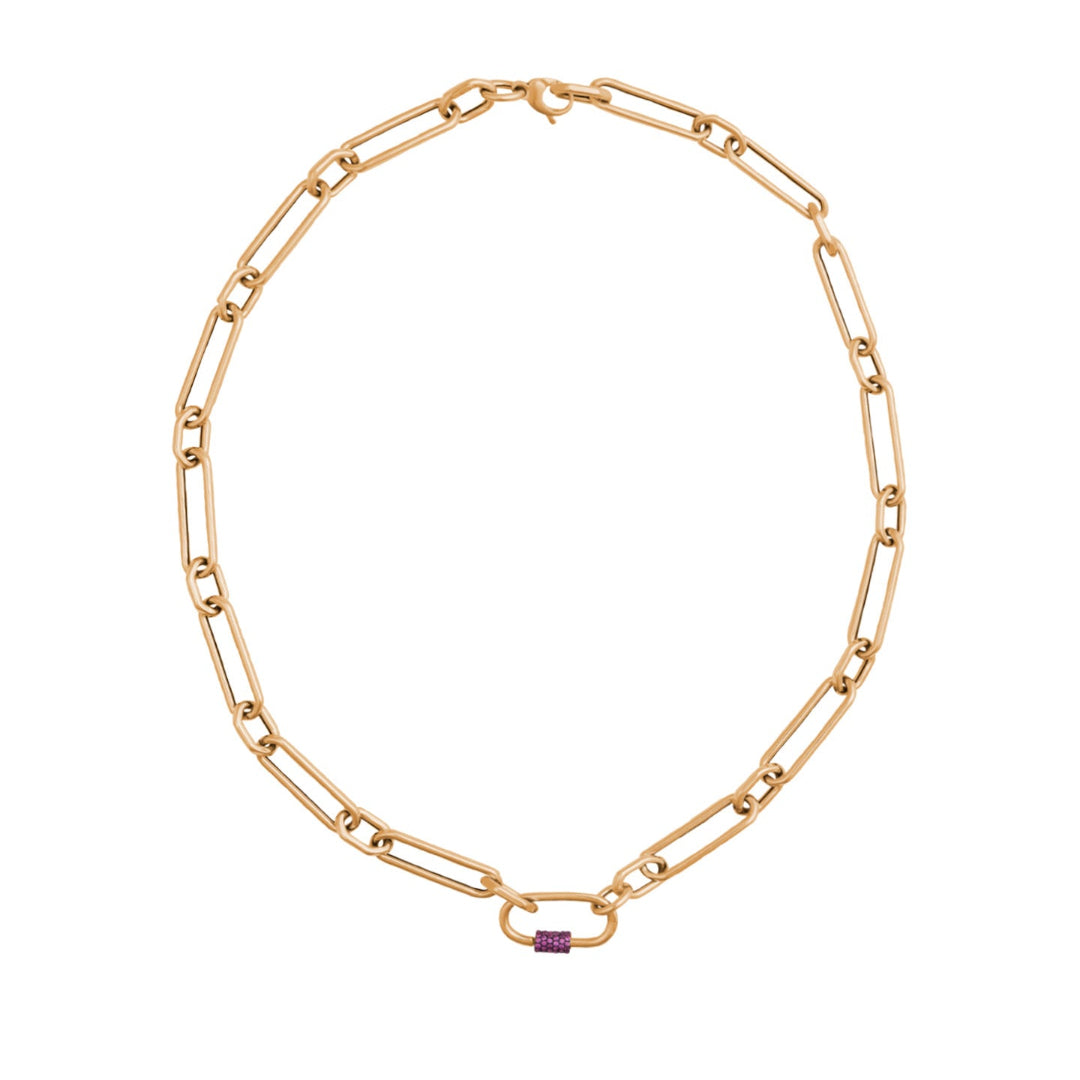 A gold hexagon link chain necklace with a screw lock carabiner featuring a pink sapphire.