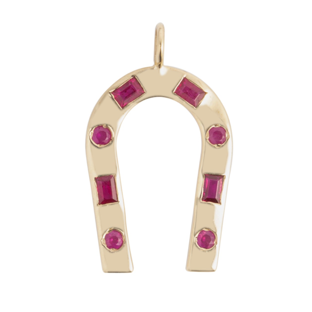 A 14k gold horseshoe-shaped pendant featuring .52 carats of red ruby stones.
