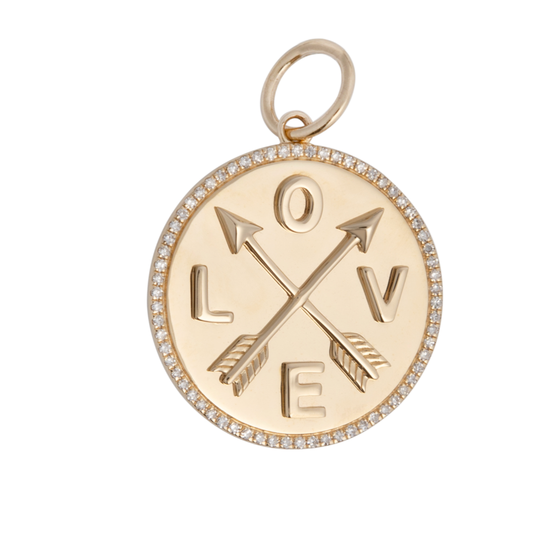 A 14k gold diamond pendant with a love arrow and diamond design, attached to a small chain.