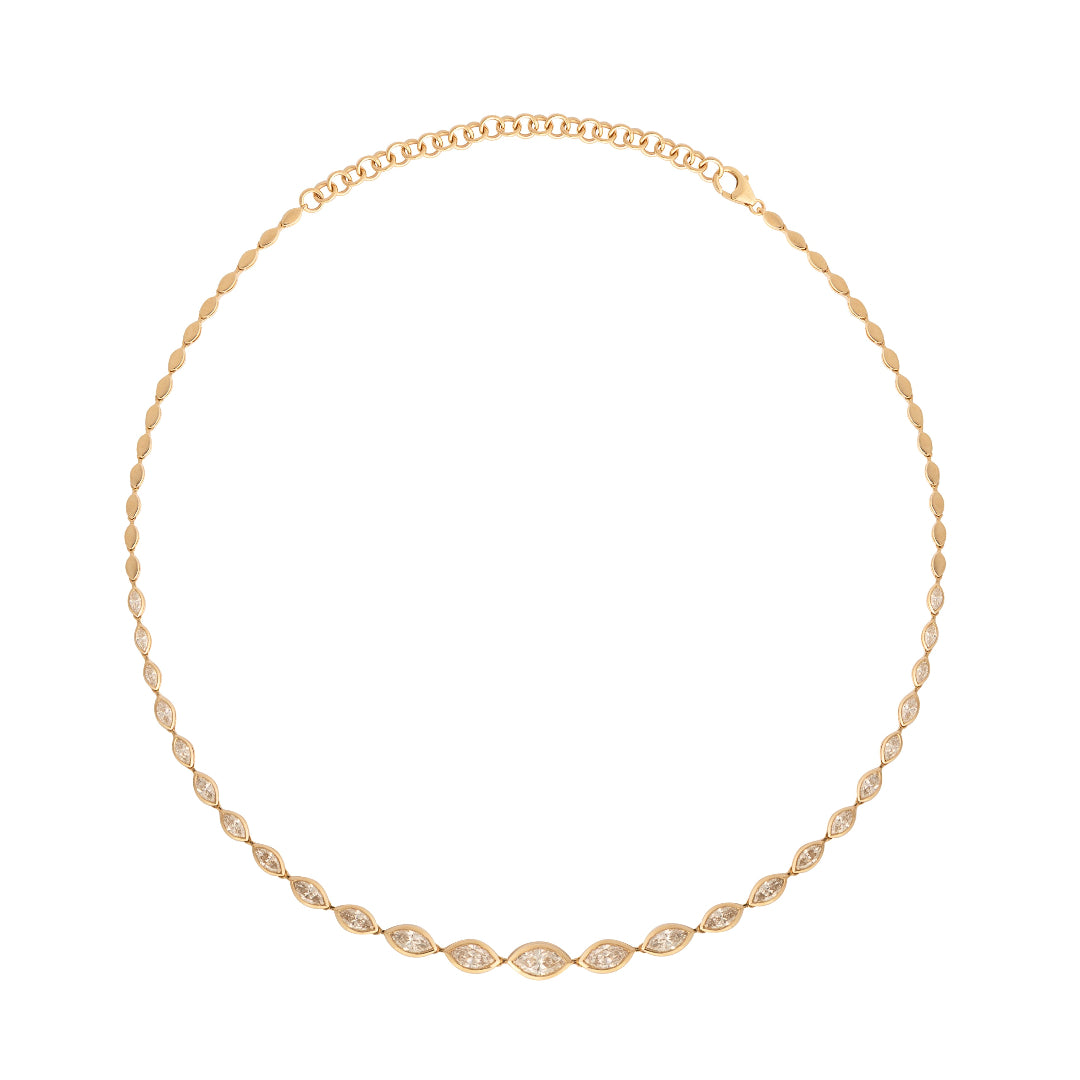 Gold necklace with marquis diamonds on a white background