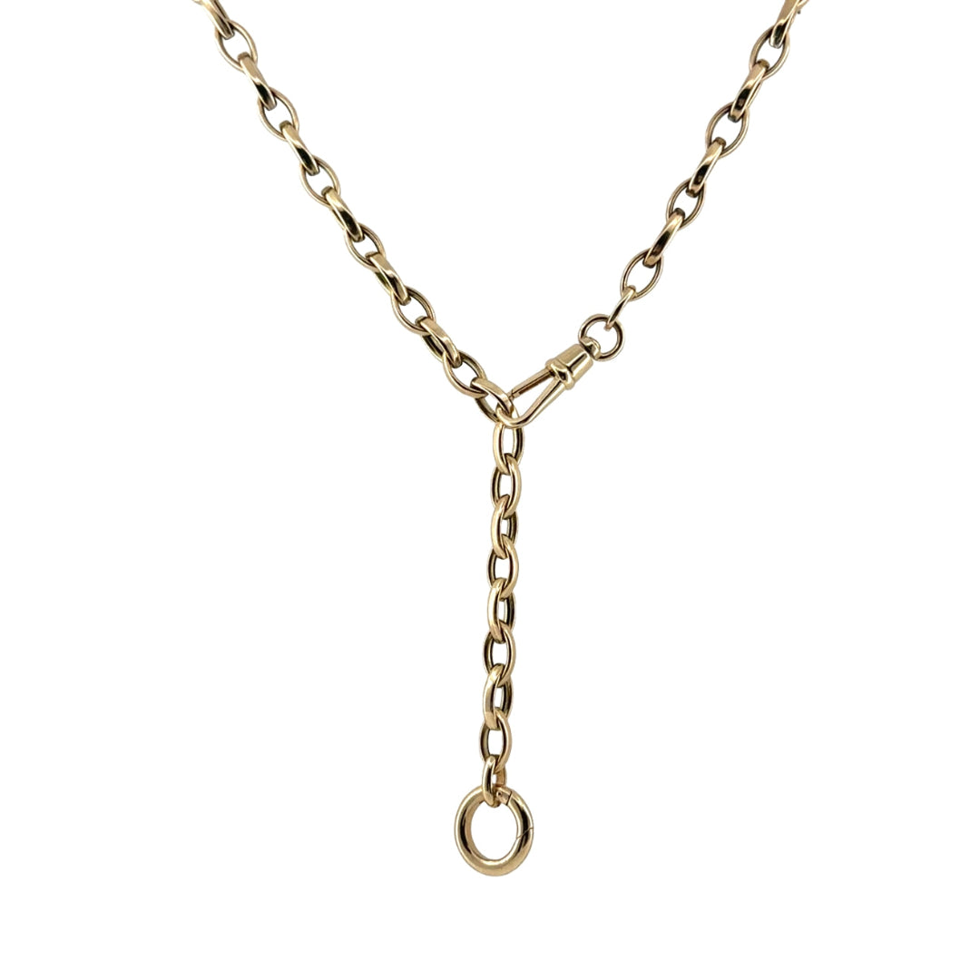 A 14k gold marquise shaped link chain styled as a lariat on a white background.