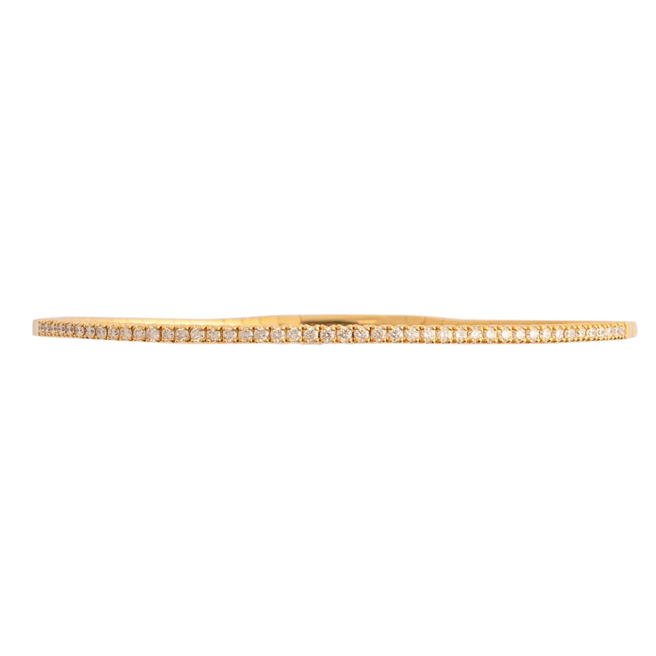 Gold bracelet with diamonds on a white background