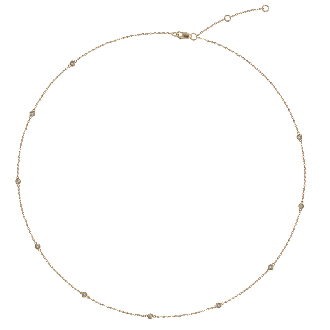 A 14k gold chain necklace with a series of diamonds attached to the chain.