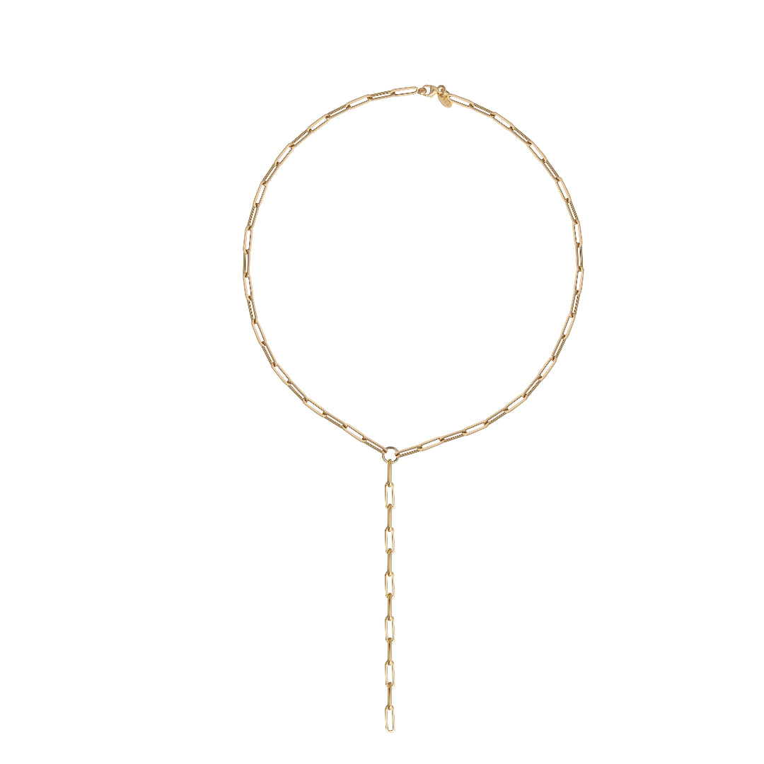A gold lariat chain necklace on a white background.