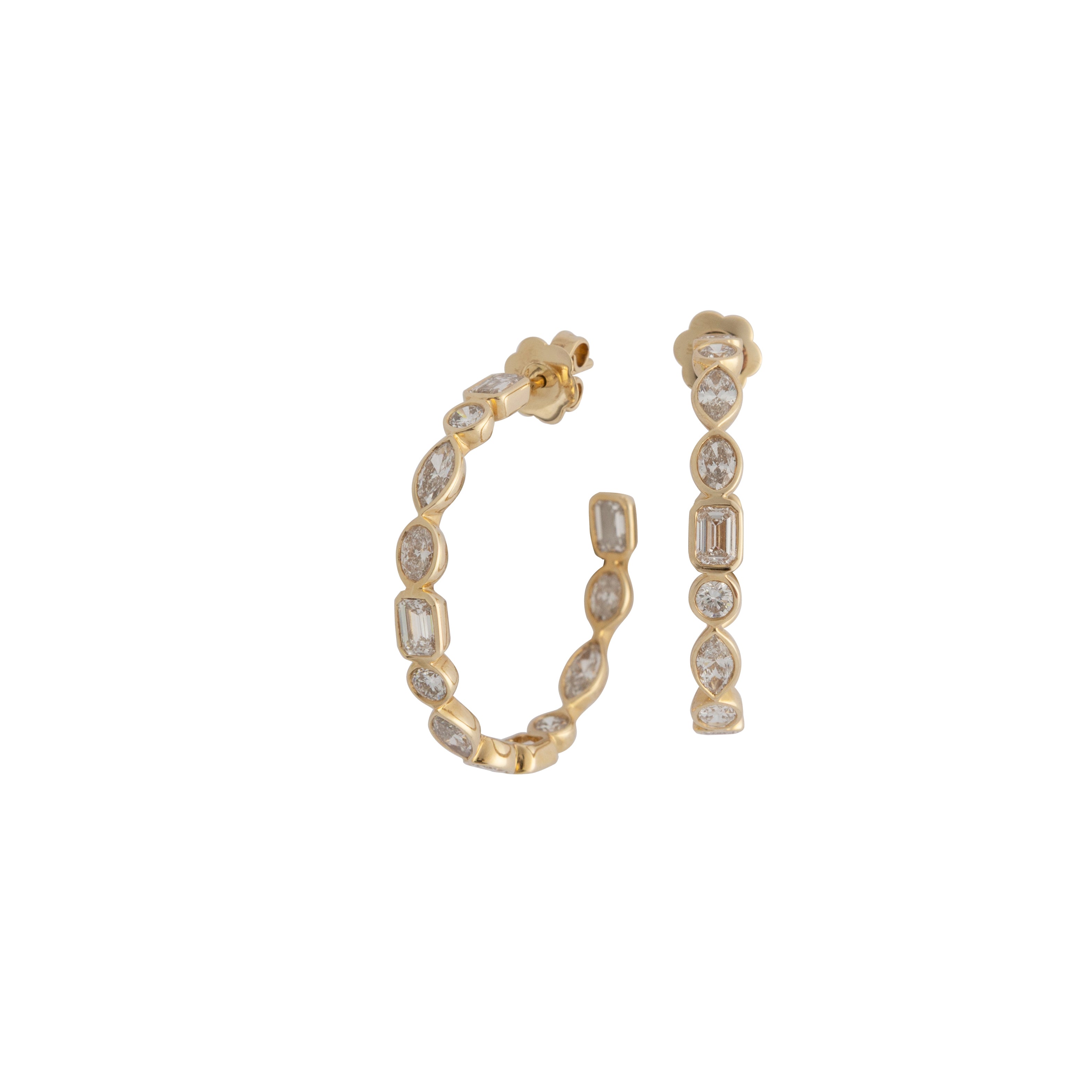 A pair of gold hoop earrings with multi-shaped lab-grown diamonds attached to them.