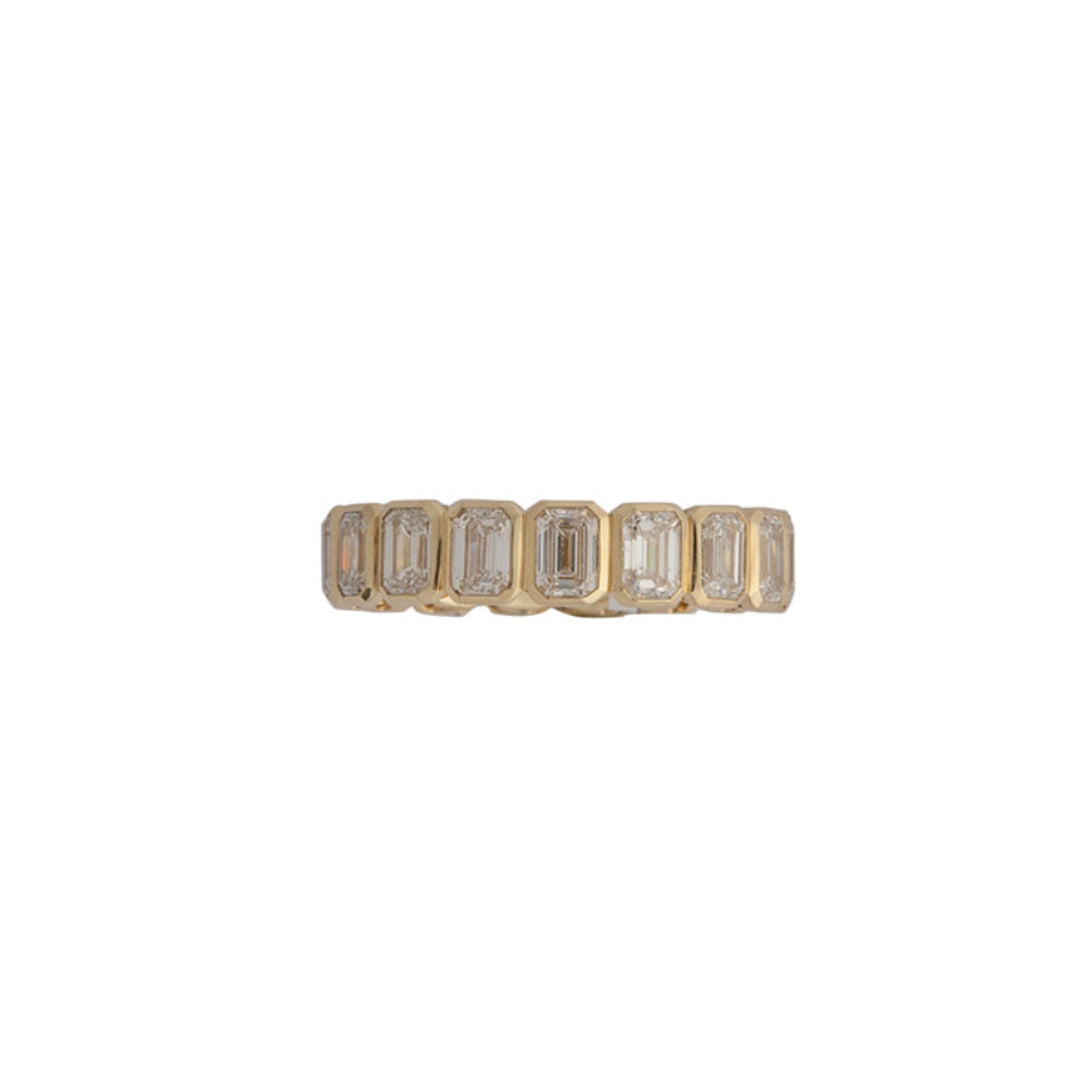 An eternity band featuring North-South emerald cut lab-grown diamonds set in 14k gold.