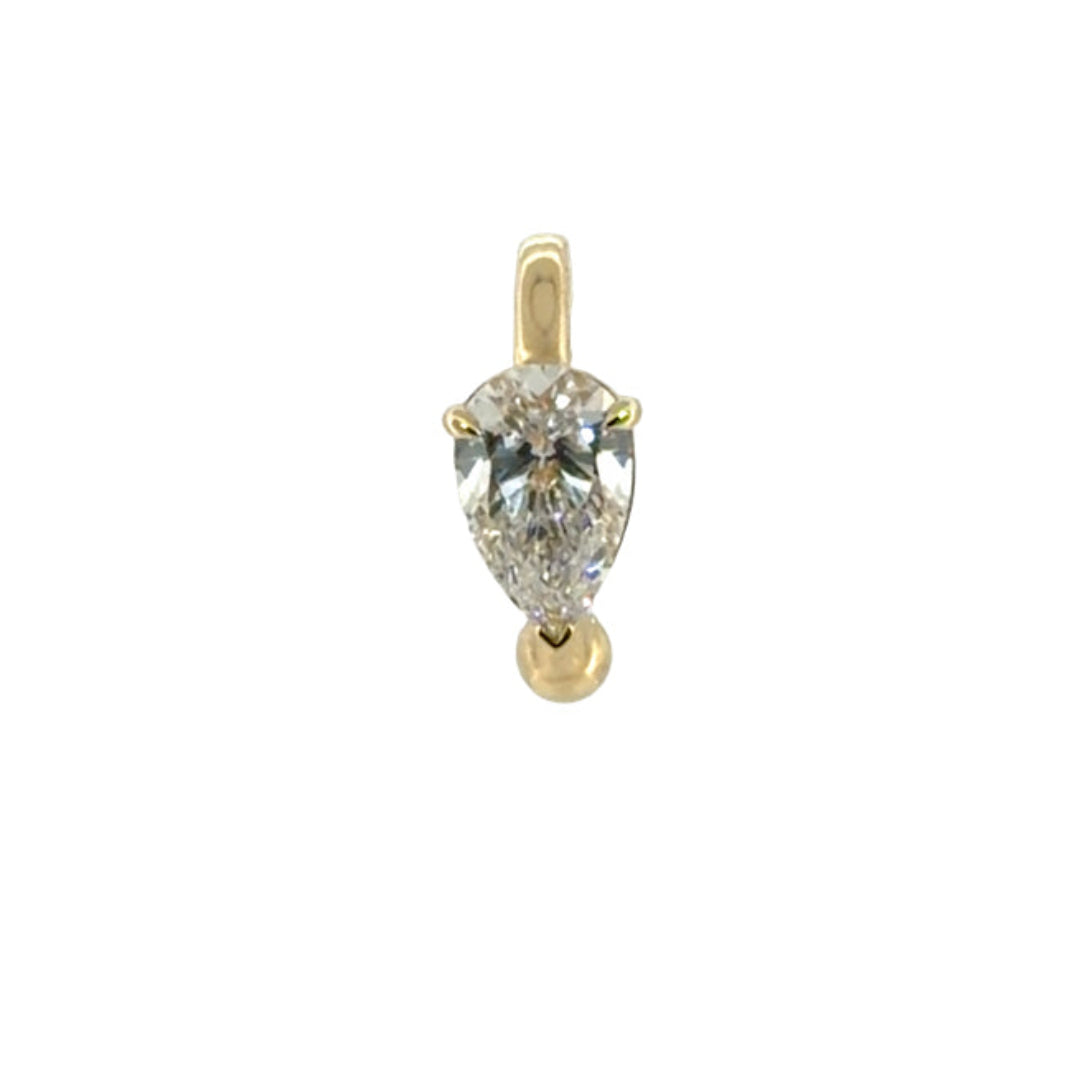 A 14k gold ear cuff with a .75 carat lab-grown diamond on a white background.