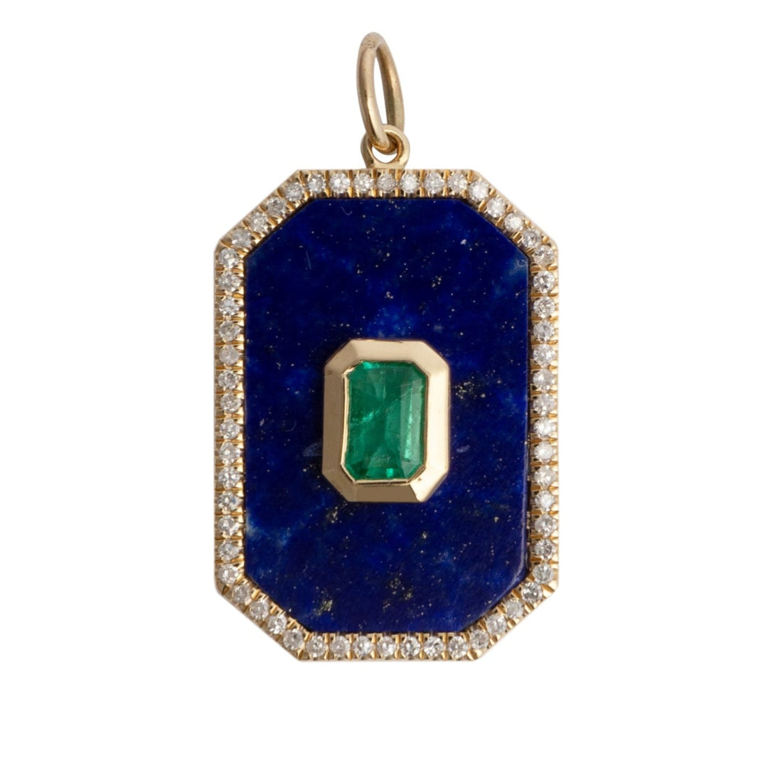 A rectangular lapis and emerald pendant with a gold rim and encrusted with diamonds on a white background.