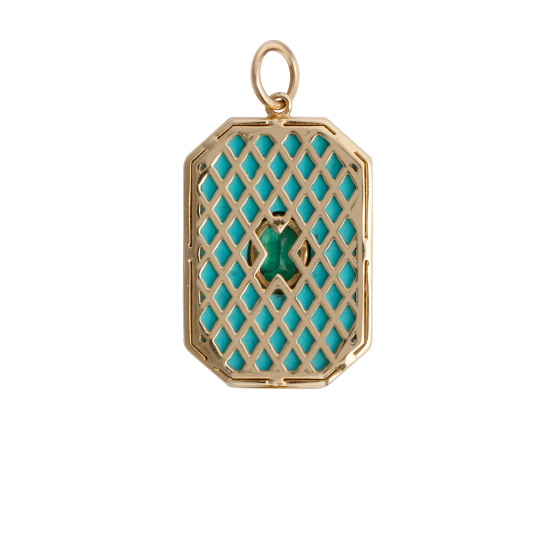 The back of a pendant with a 14k gold lattice design set on a white background.