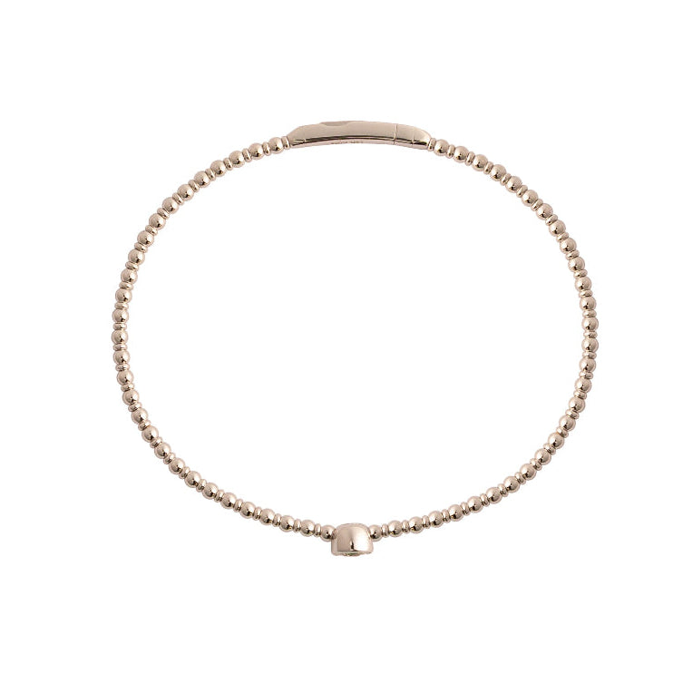 A white gold bangle on a white background