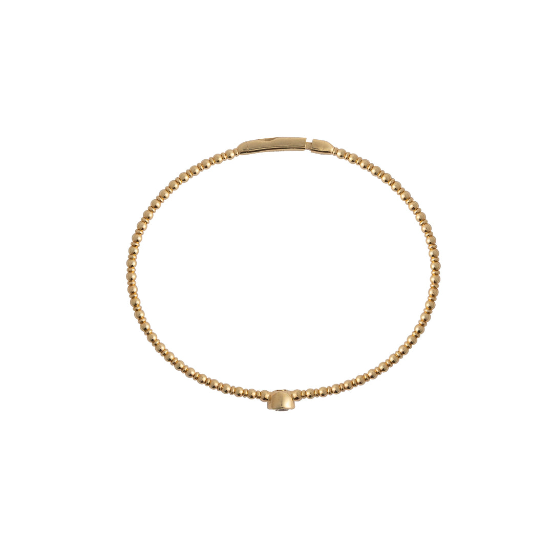 Gold bracelet on a white background
