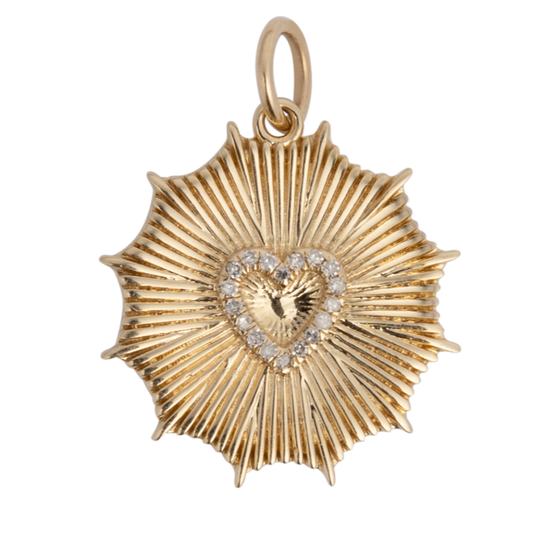 A 14k gold pendant featuring a single heart-shaped design surrounded by sunray patterns, adorned with diamonds.
