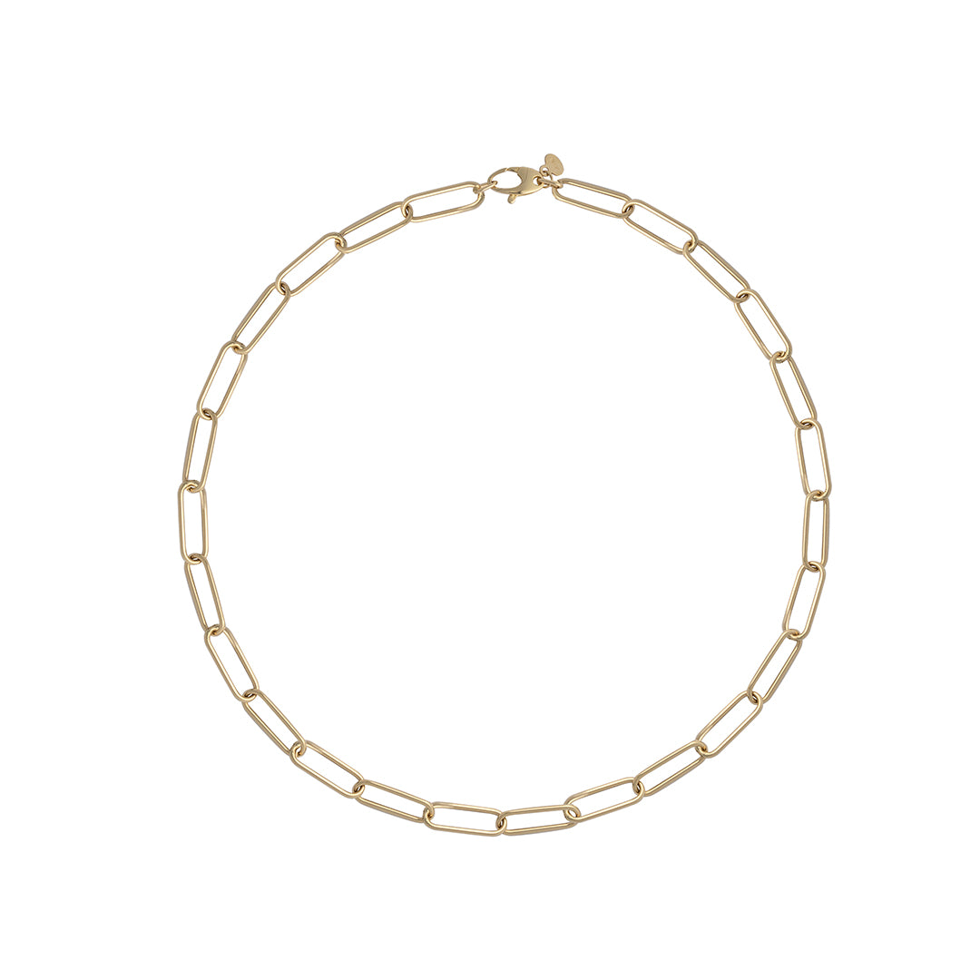 A 14k gold slim link paperclip chain necklace laid out on a plain background.