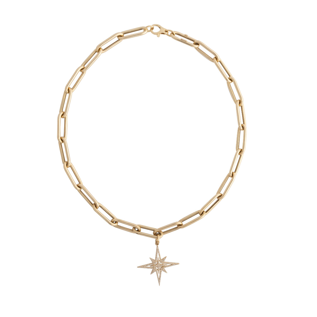 A white background with a paperclip chain necklace and a Starburst Diamond Pendant attached.