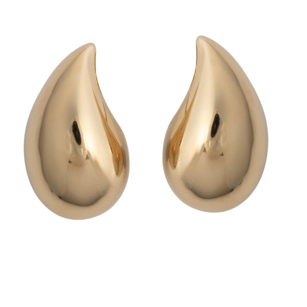 A pair of teardrop-shaped gold earrings with posts.