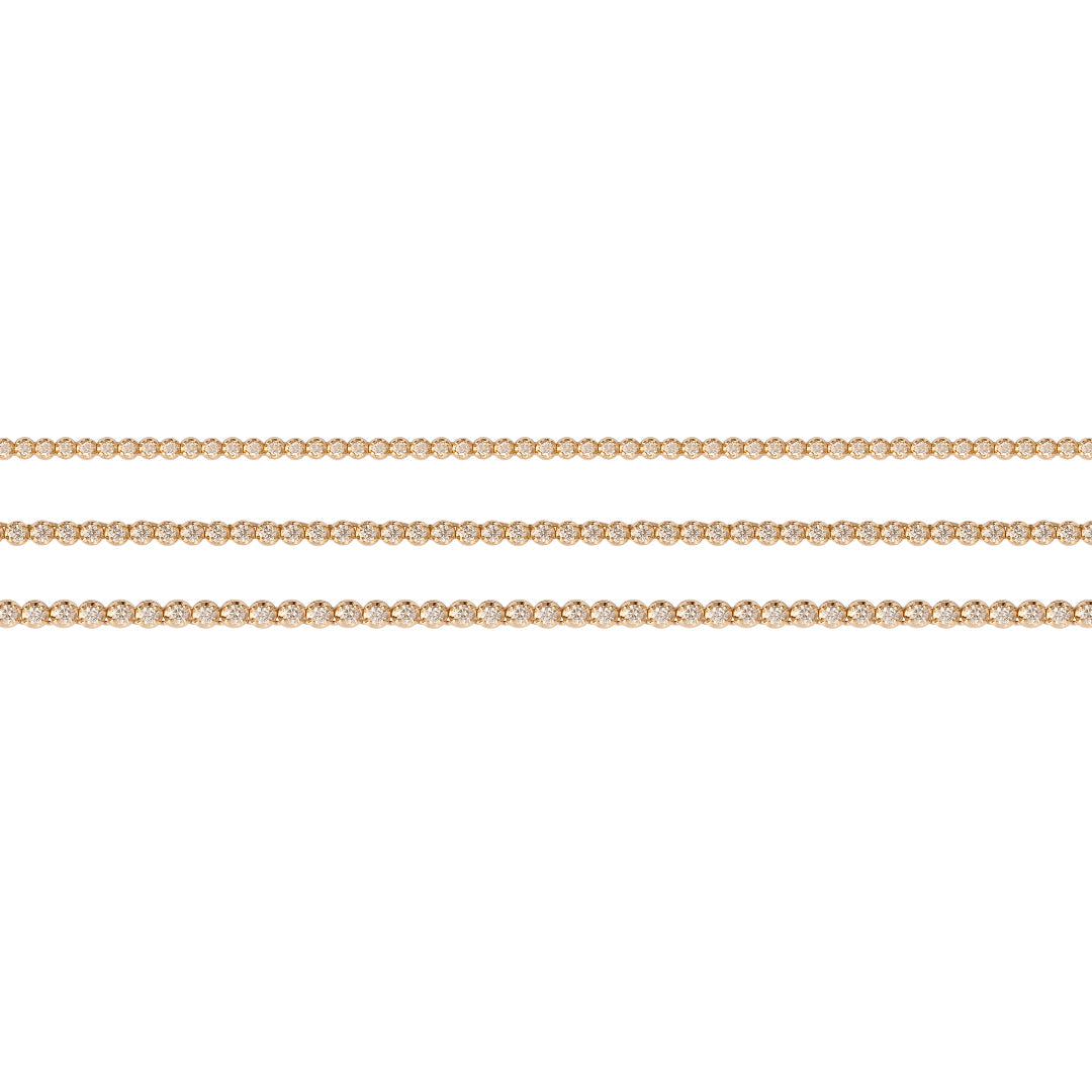 Three tennis necklaces of varying sizes on a white background.