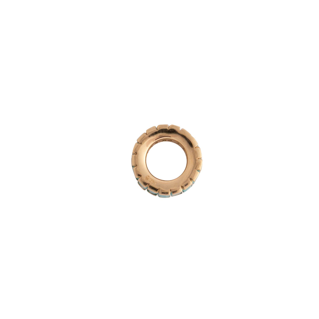 A side view of a 14k gold roundel bead on a white background.