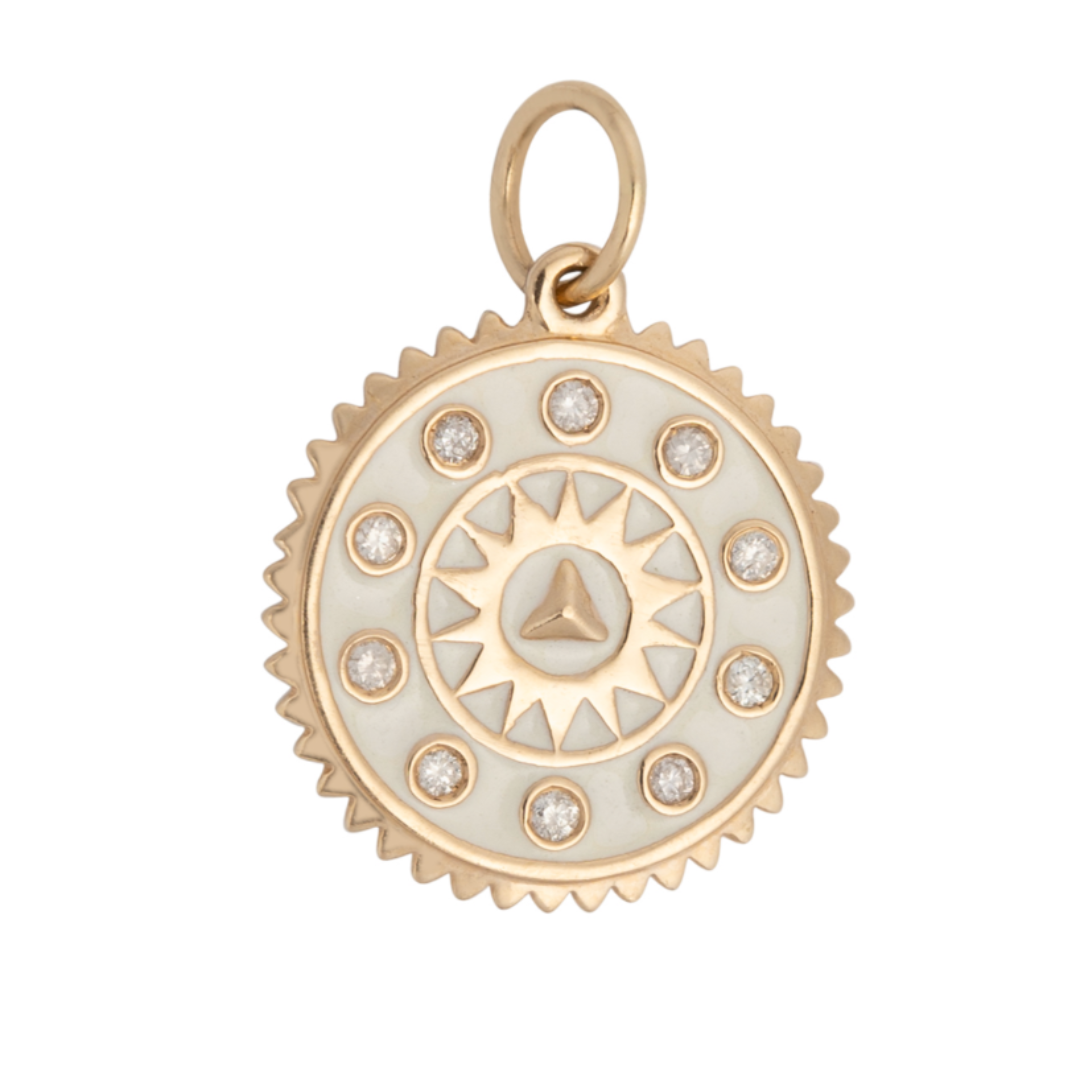 A white enamel and diamond pendant with a gold metal chain.
