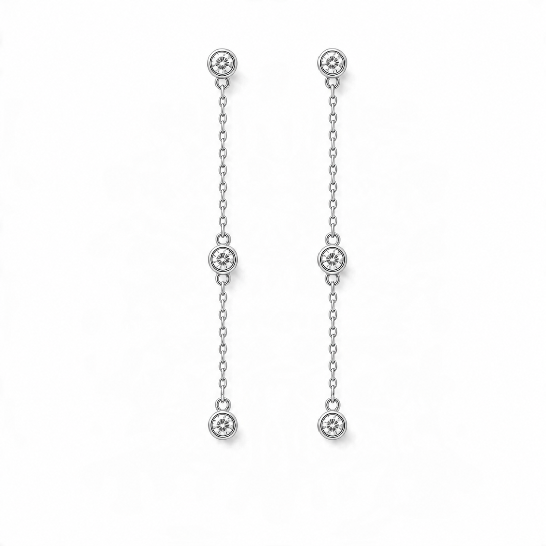 14k white gold diamond station drop earrings on a white background.