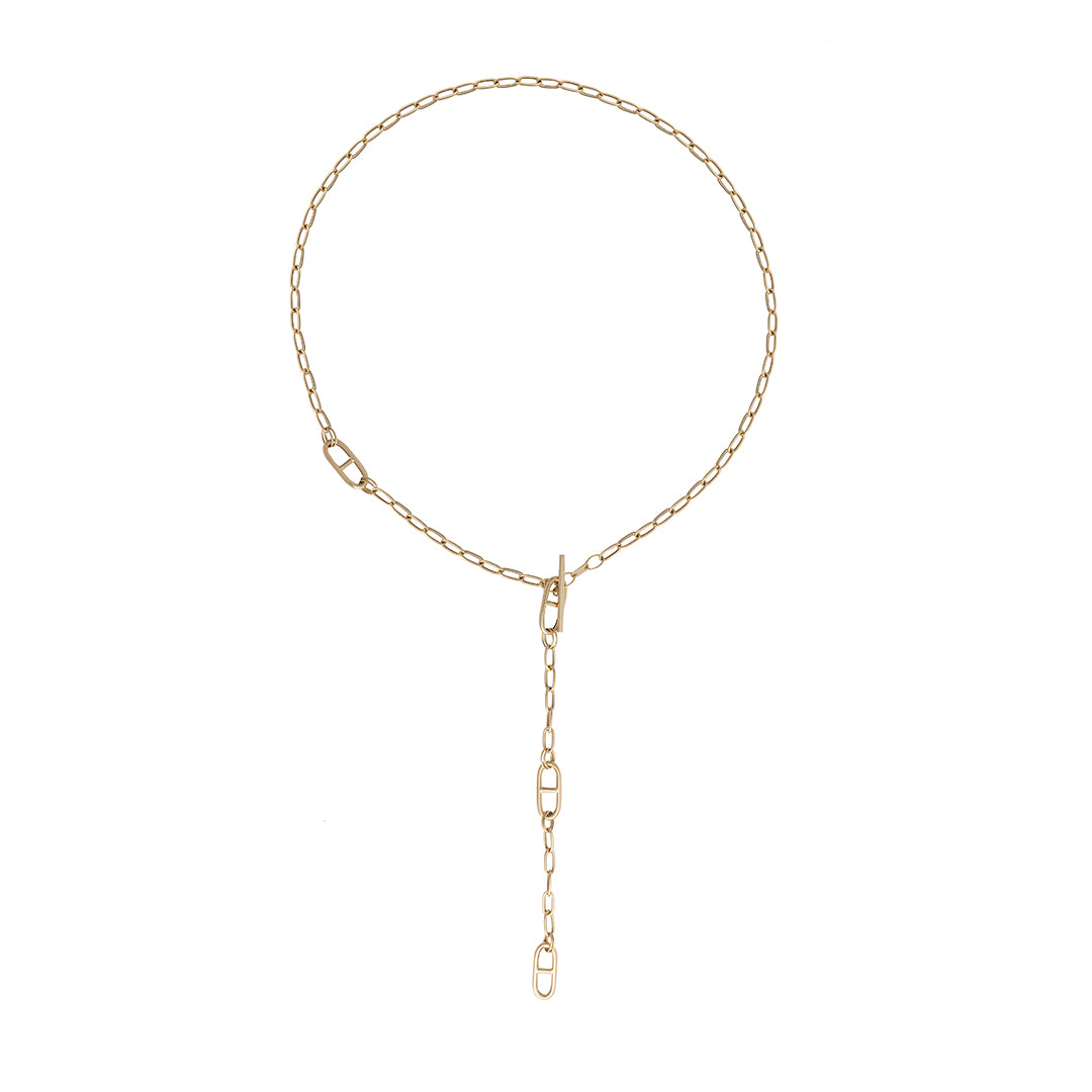 Gold chain lariat necklace on a white background