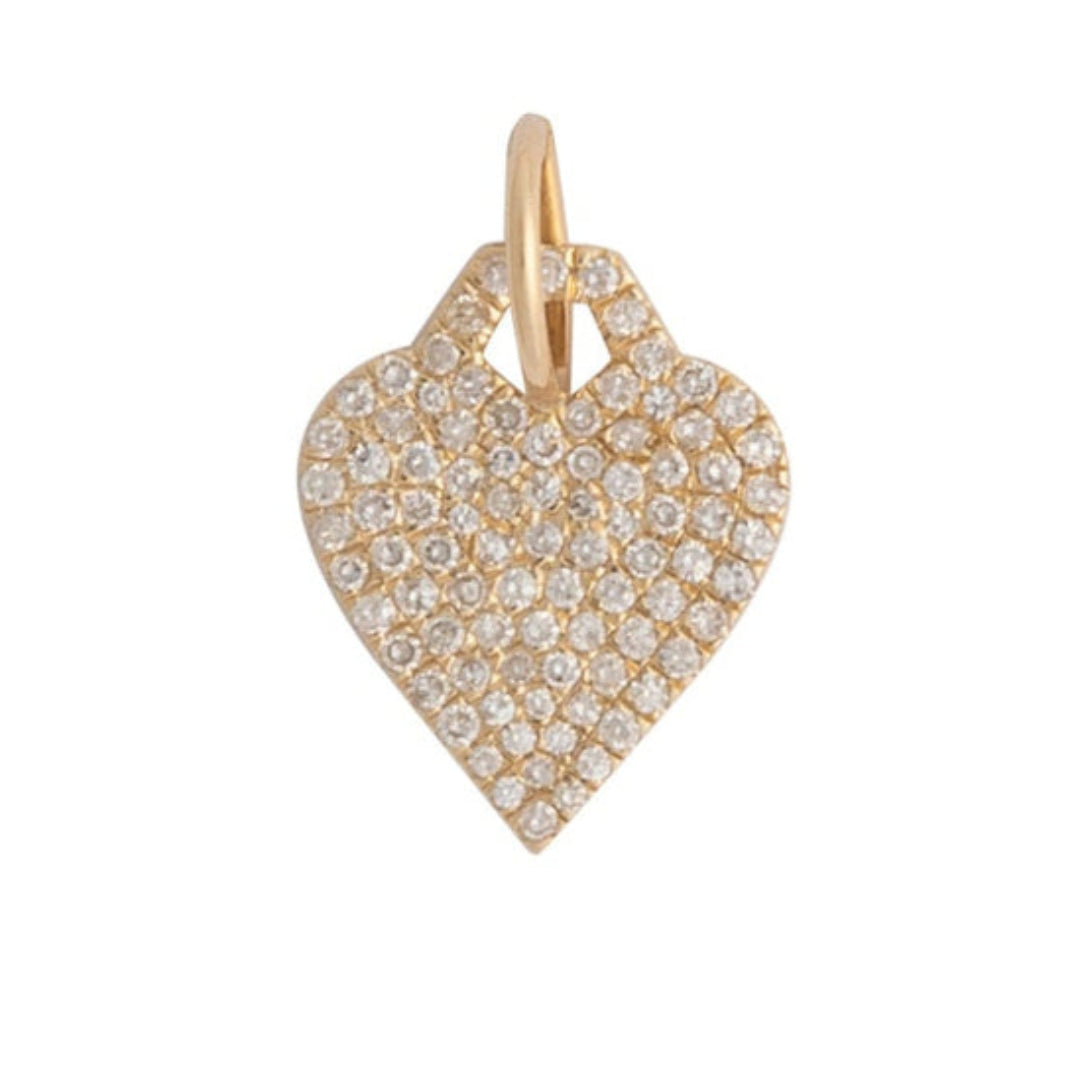 Heart-shaped gold pendant with embedded stones on a white background