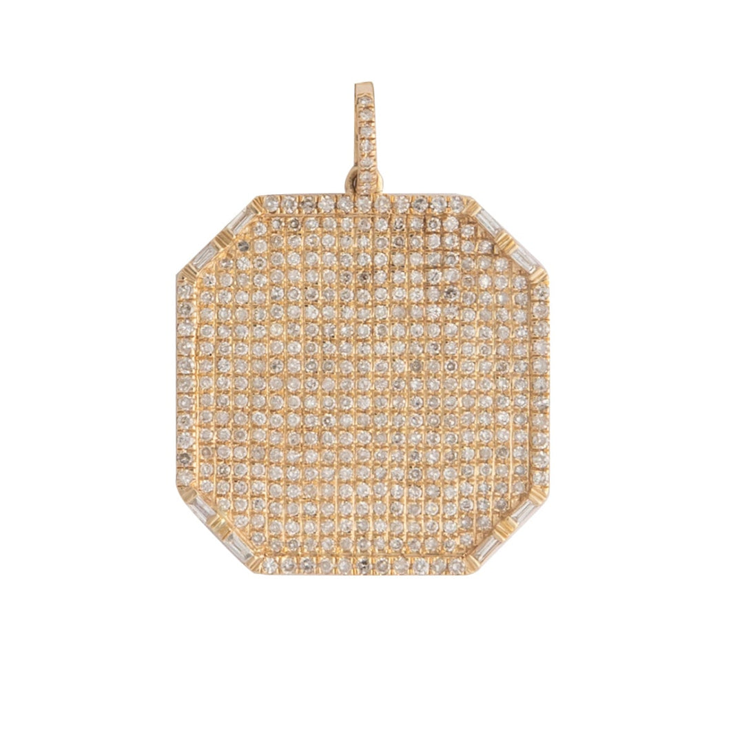 Gold and pave diamond pendant on a white background