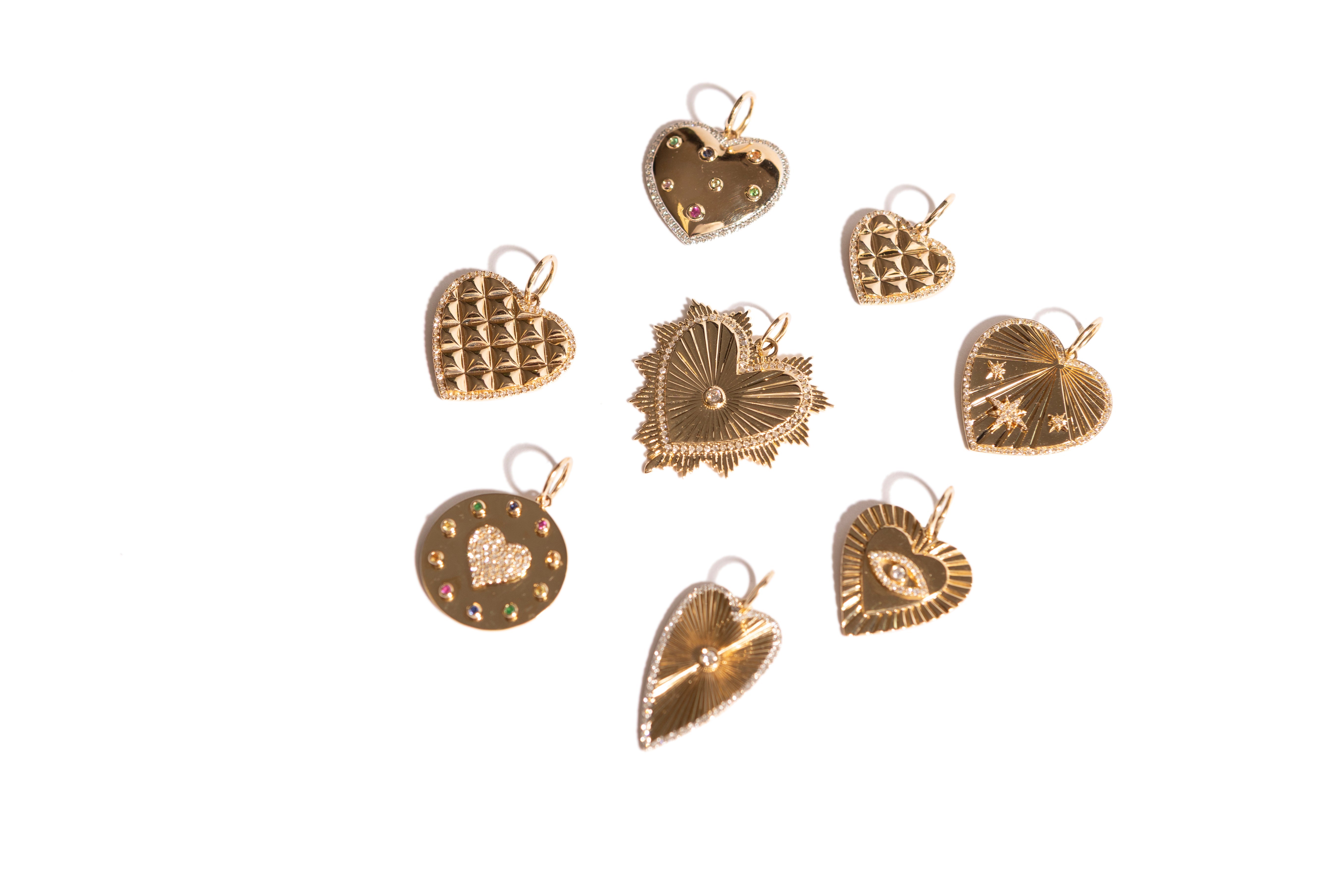 A picture with numerous heart pendants on a white background.