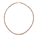 A close up of an Andalusite & Gold Bead Necklace on a white background. 