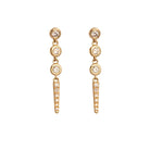 Gold stud earrings with diamonds on a white background. 
