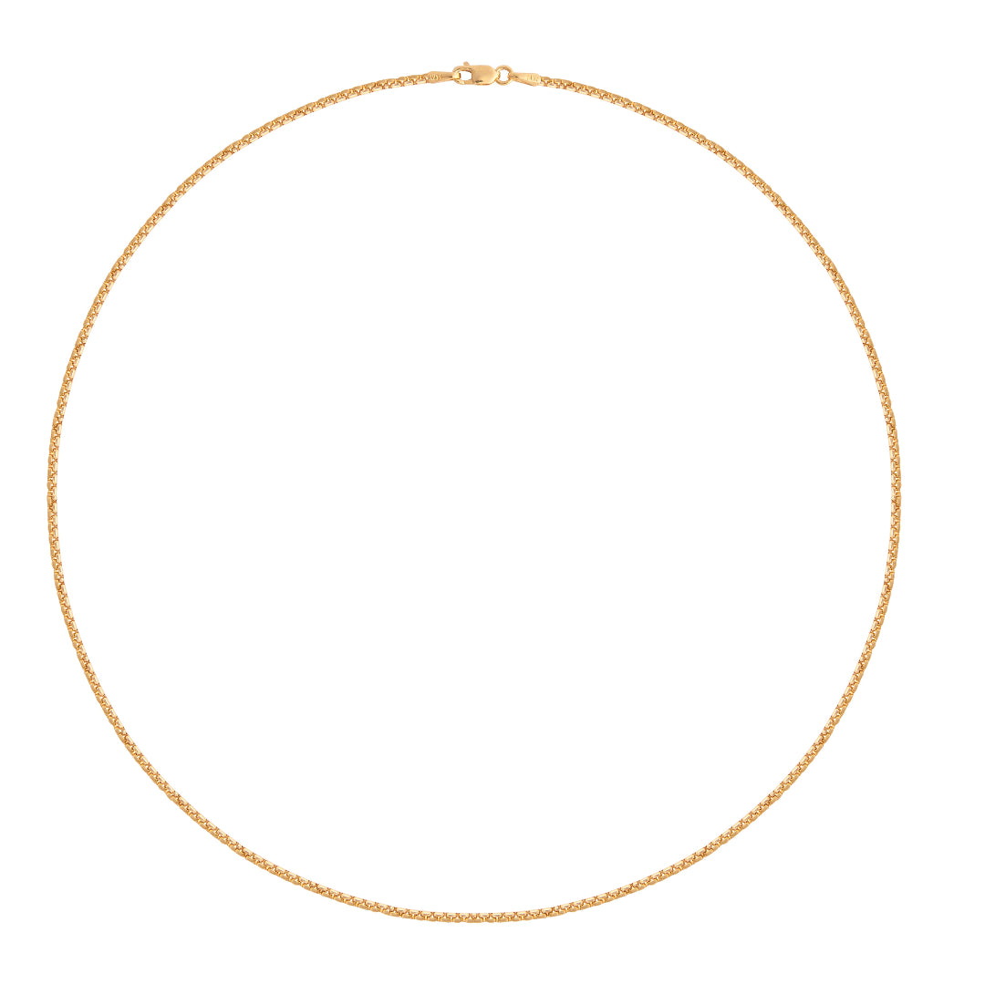 Gold chain necklace on a white background